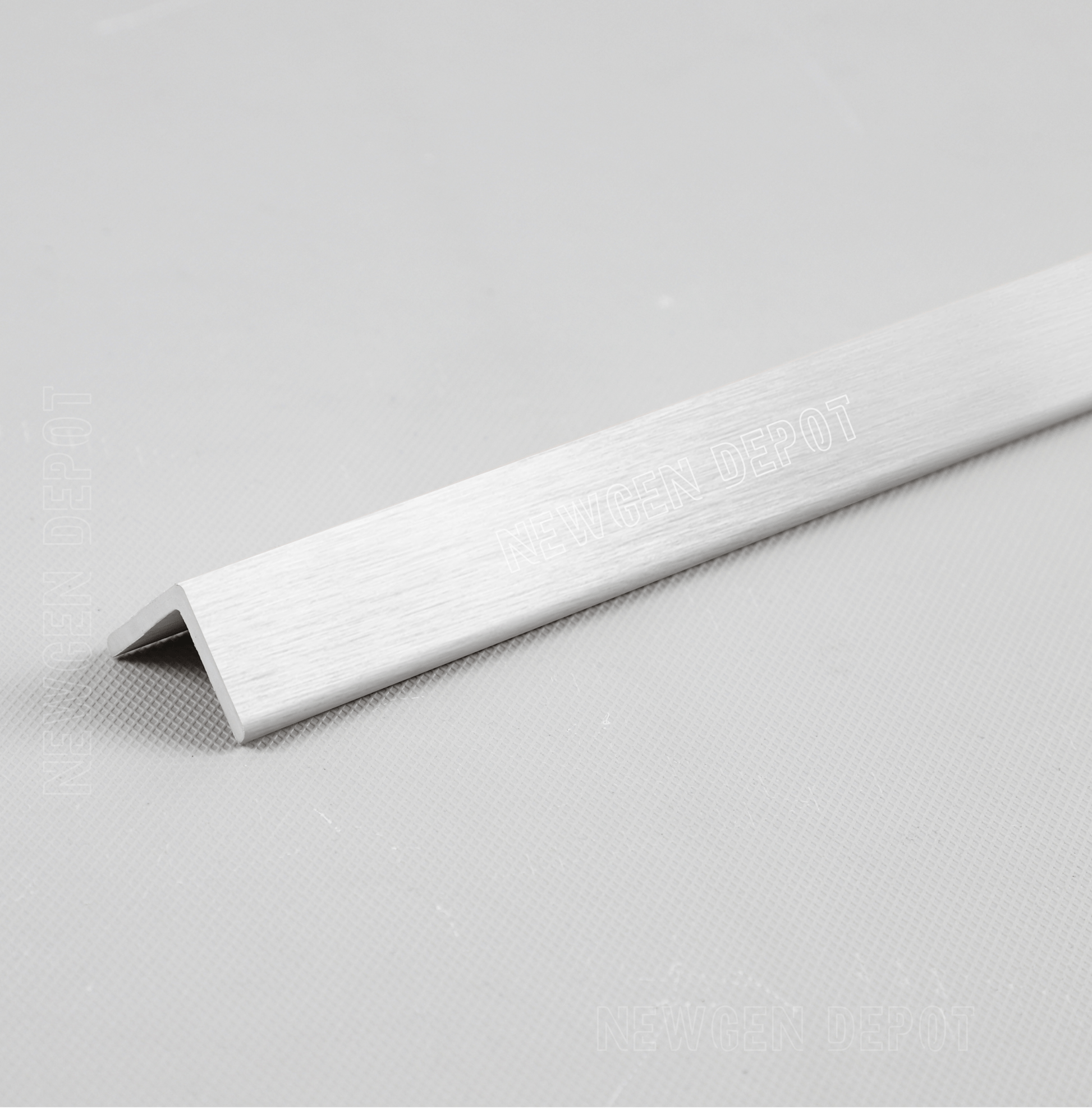 Silver brushed aluminum corner trim, 90-degree angle, premium finish for NJ furniture edges, sleek and durable design.