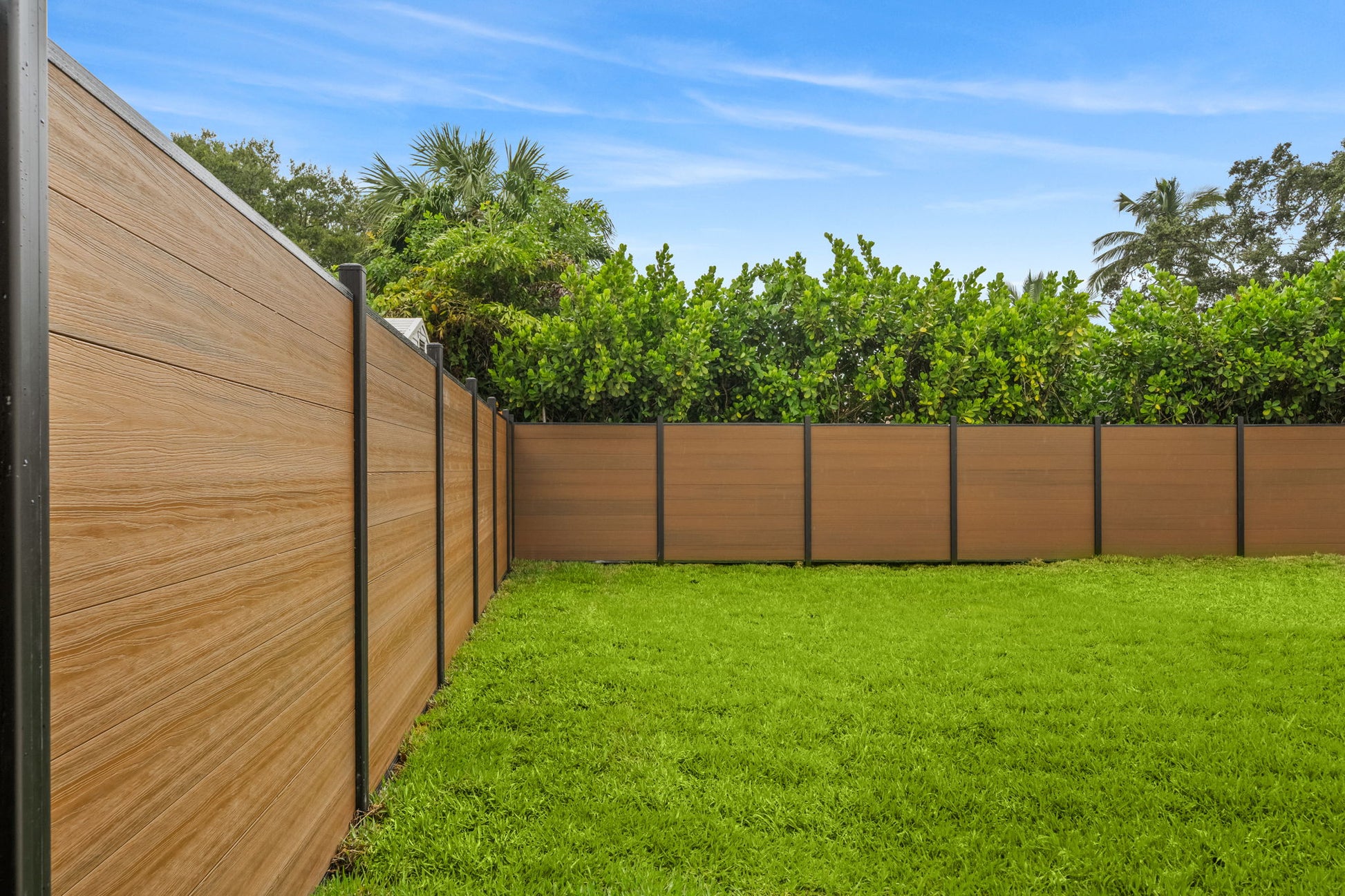 Walnut co extruded composite backyard fence
