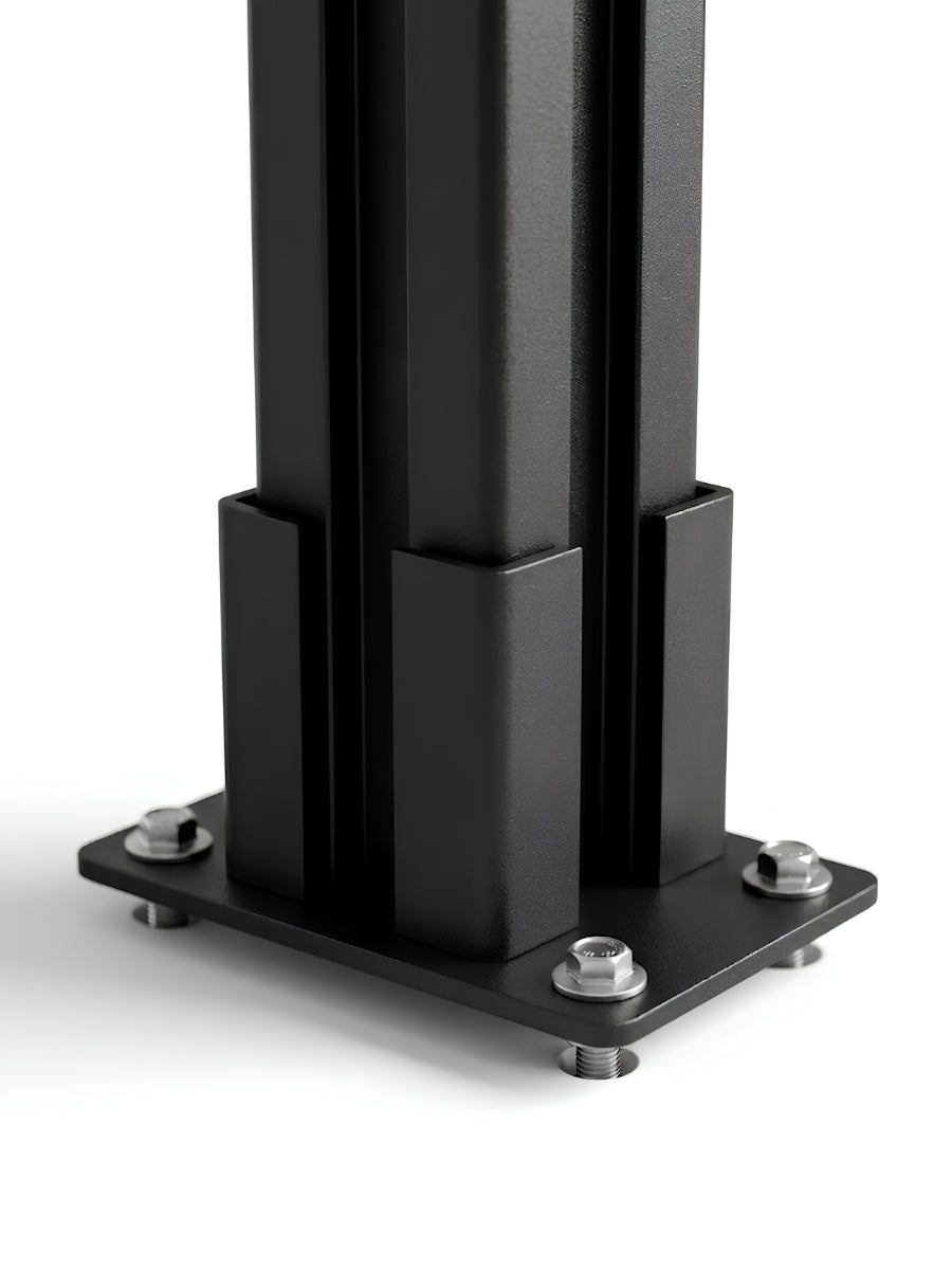 Close-up of the above-ground fence post base secured with four bolts