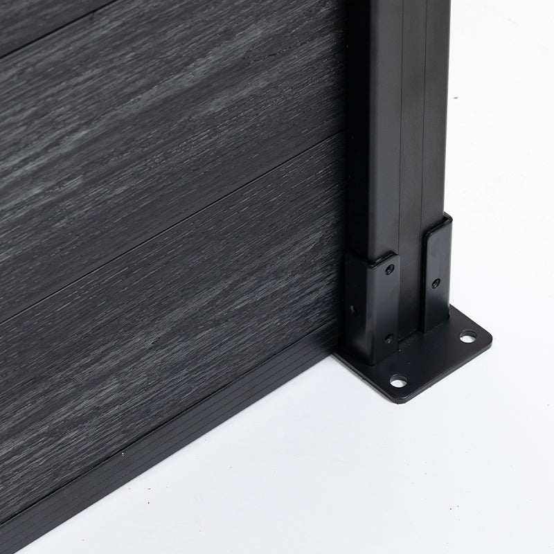 Close-up of black composite fence panel with aluminum post base and mounting bracket