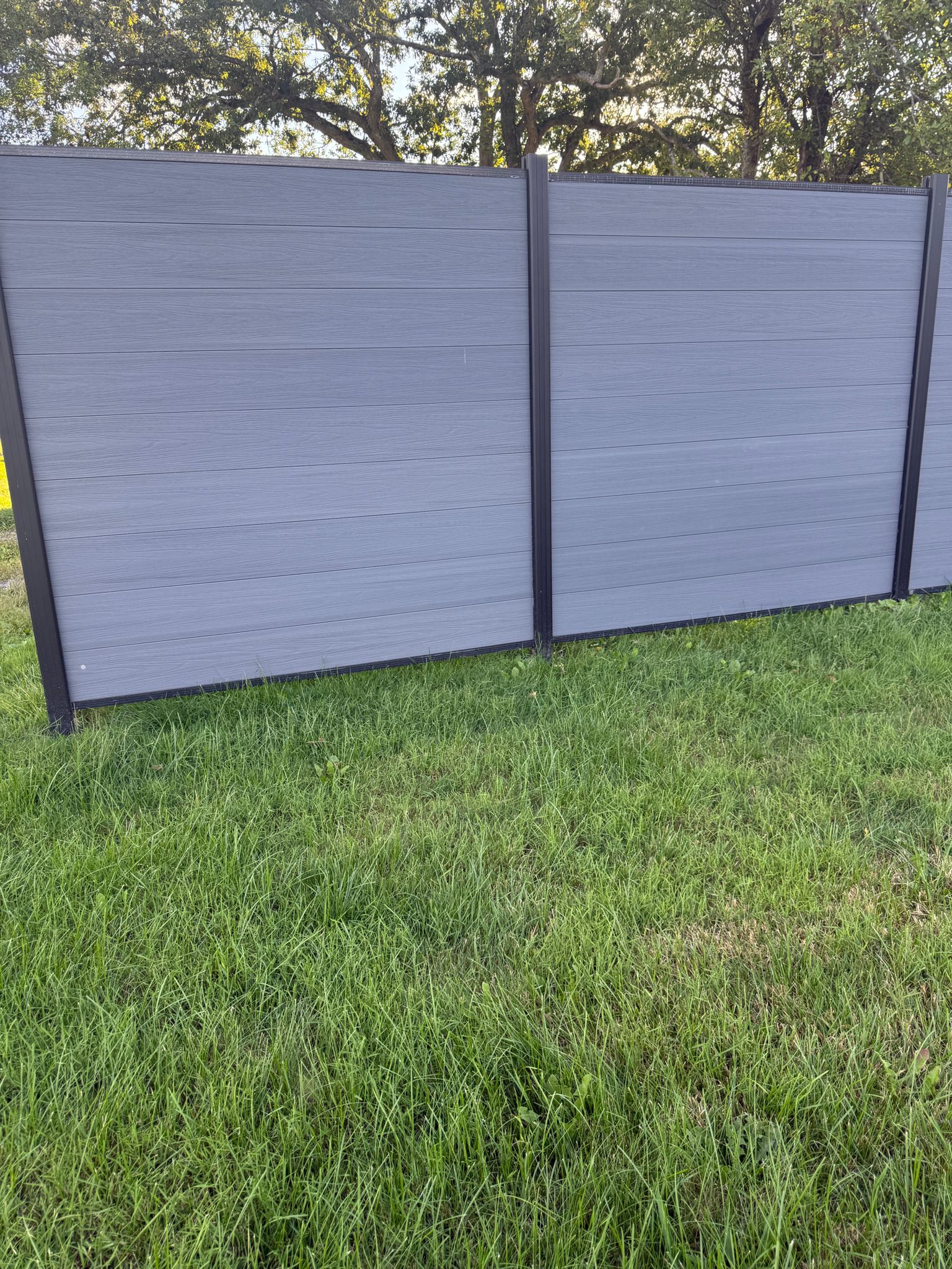 Modern light gray co extruded composite fence
