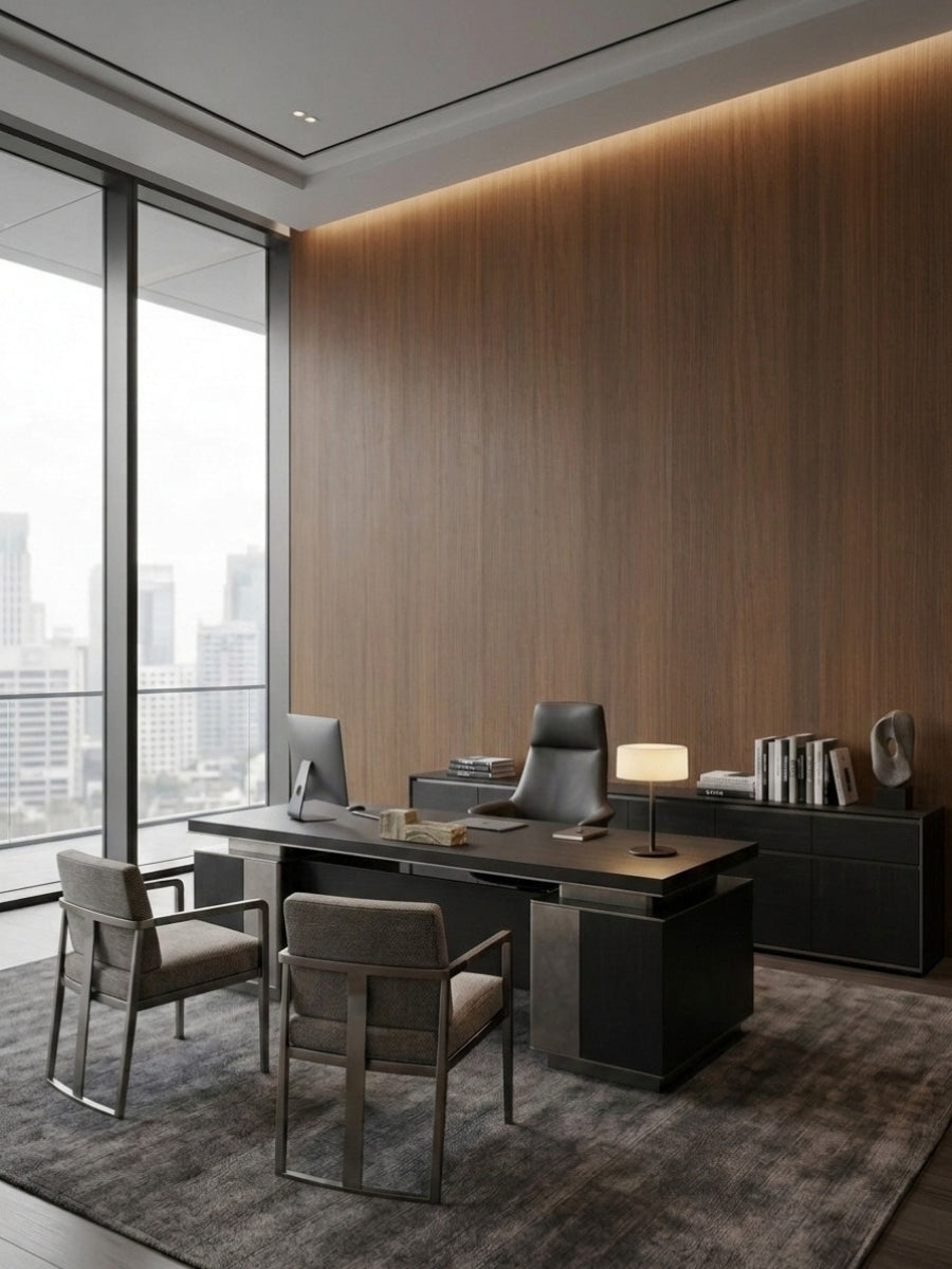 Walnut wood veneer panel office wall behind a dark executive desk and guest chairs