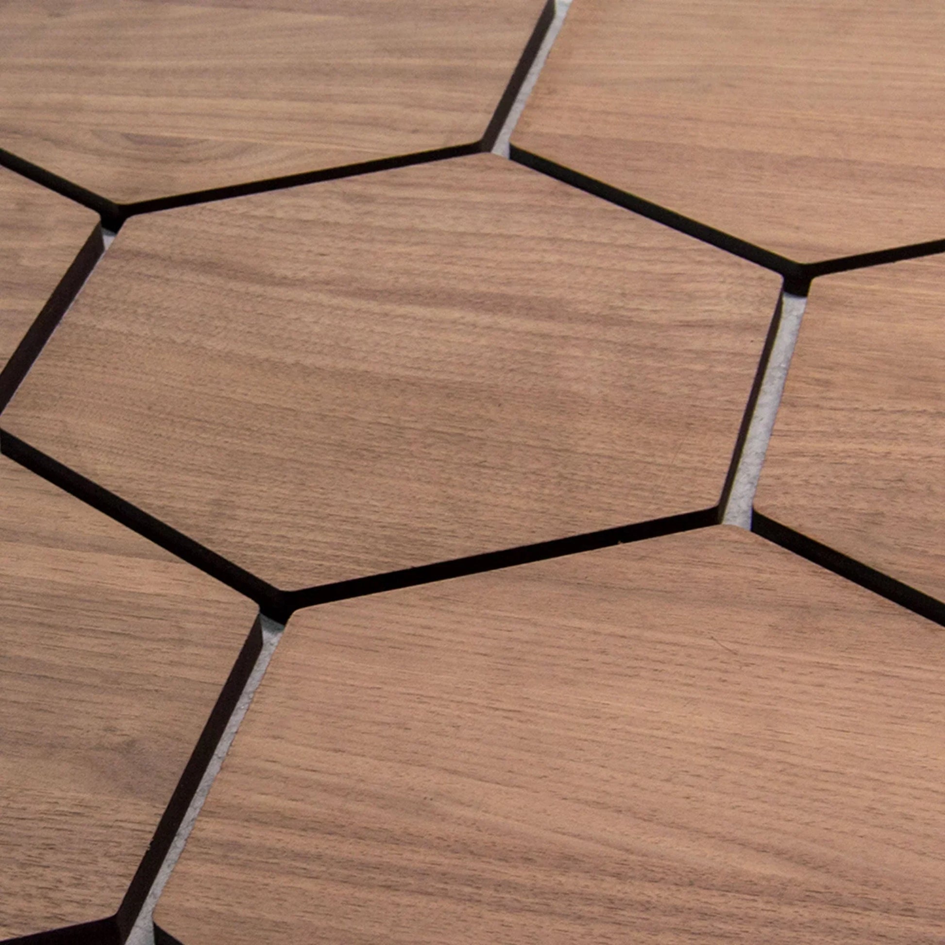 Hexagon acoustic wall panels in walnut for home and office walls